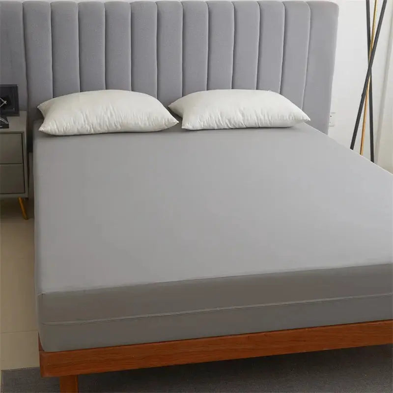 Waterproof mattress protector with zipper by Simples Market on gray bed