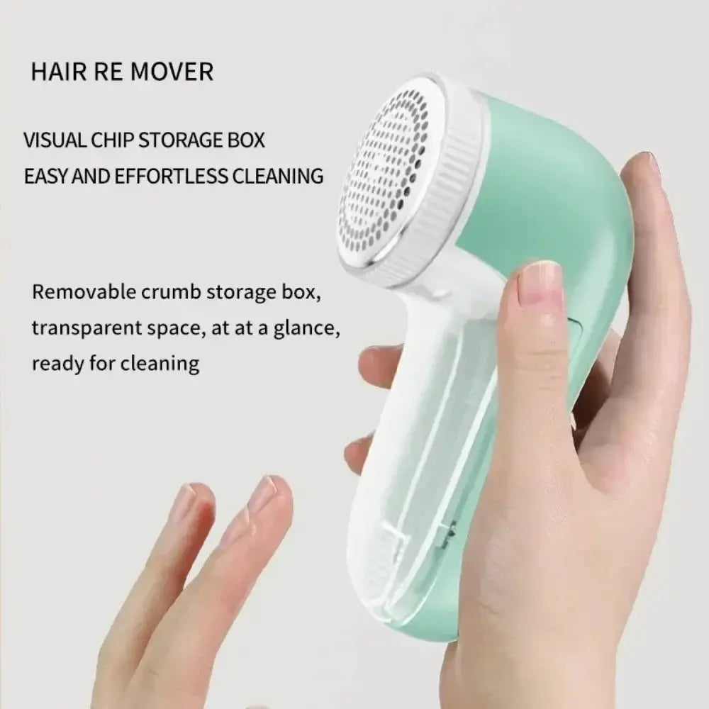 Mint green electric lint remover for clothes; handheld device for pet hair and lint