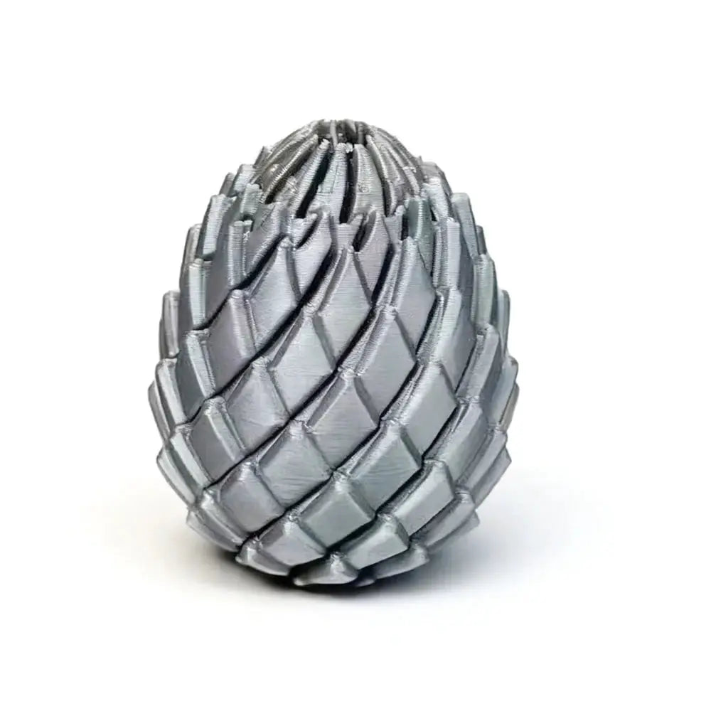 3D-printed dragon egg stress-relief sculpture, metallic silver deformable twist desk ornament