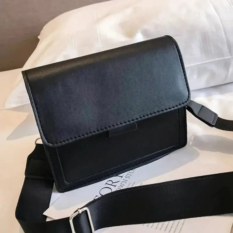 Black PU leather crossbody bag for women with front flap and adjustable strap