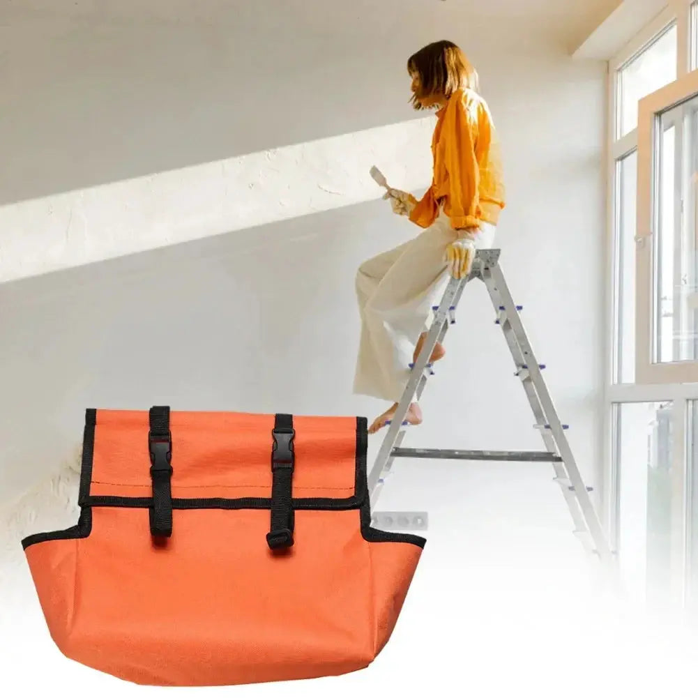 Folding ladder tool storage bag in orange Oxford cloth with black straps for portable workshop use