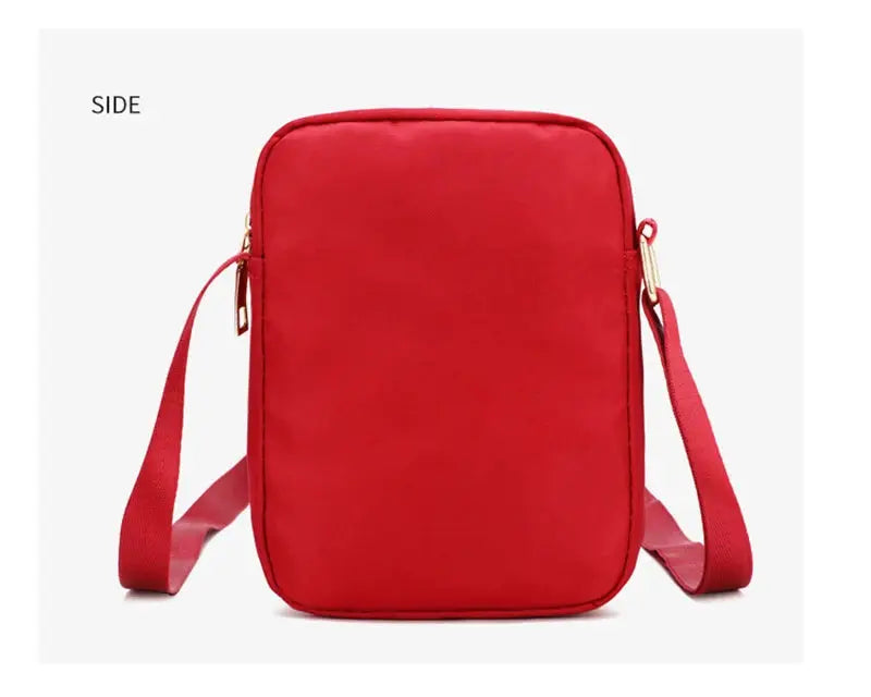 Red waterproof crossbody bag for women with zipper and adjustable shoulder strap