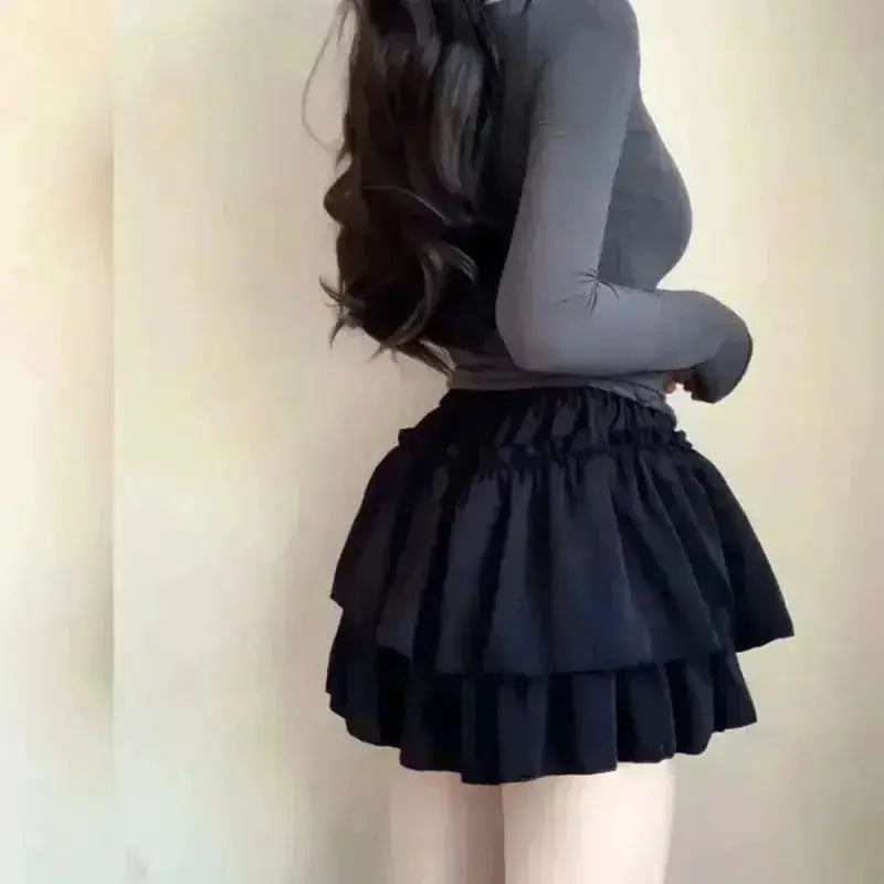 Black high-waisted mini skirt with layered ruffle tiers, A-line silhouette