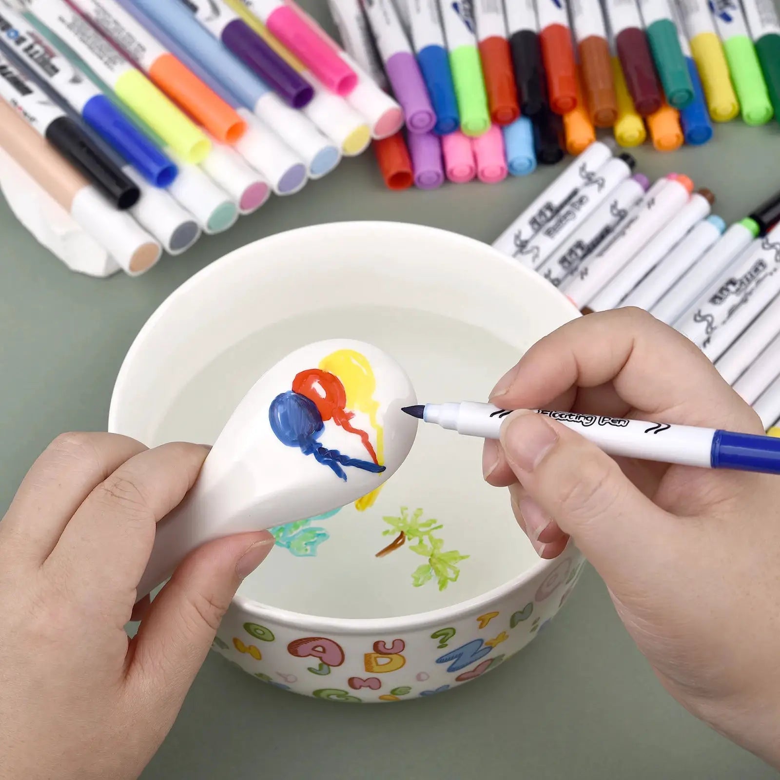 Magical Water Painting Pen set; colorful floating-ink markers for kids used to paint a ceramic egg with water