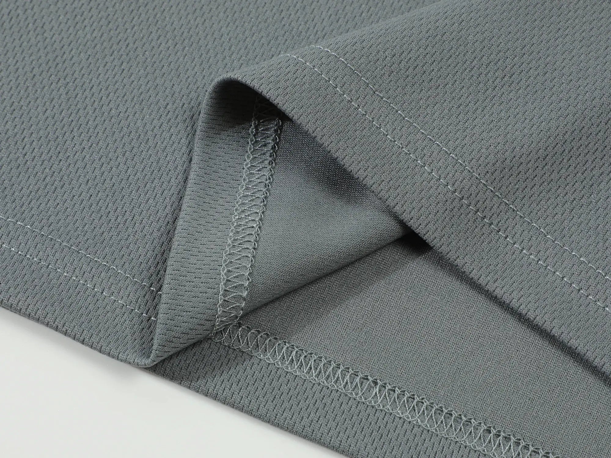 Polo shirt by Simples Market in gray solid fabric close-up with stitched seams