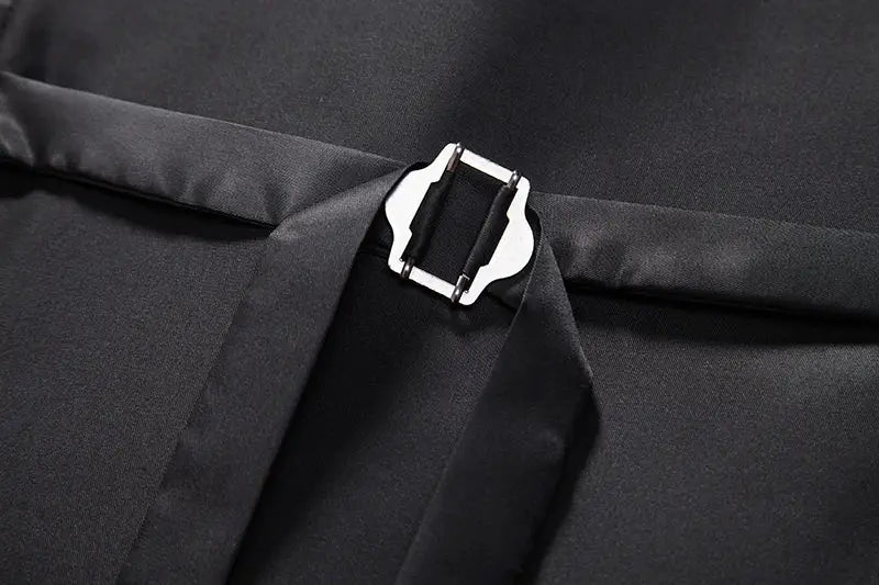 Men's black waistcoat back buckle with strap on smooth fabric; close-up detail.