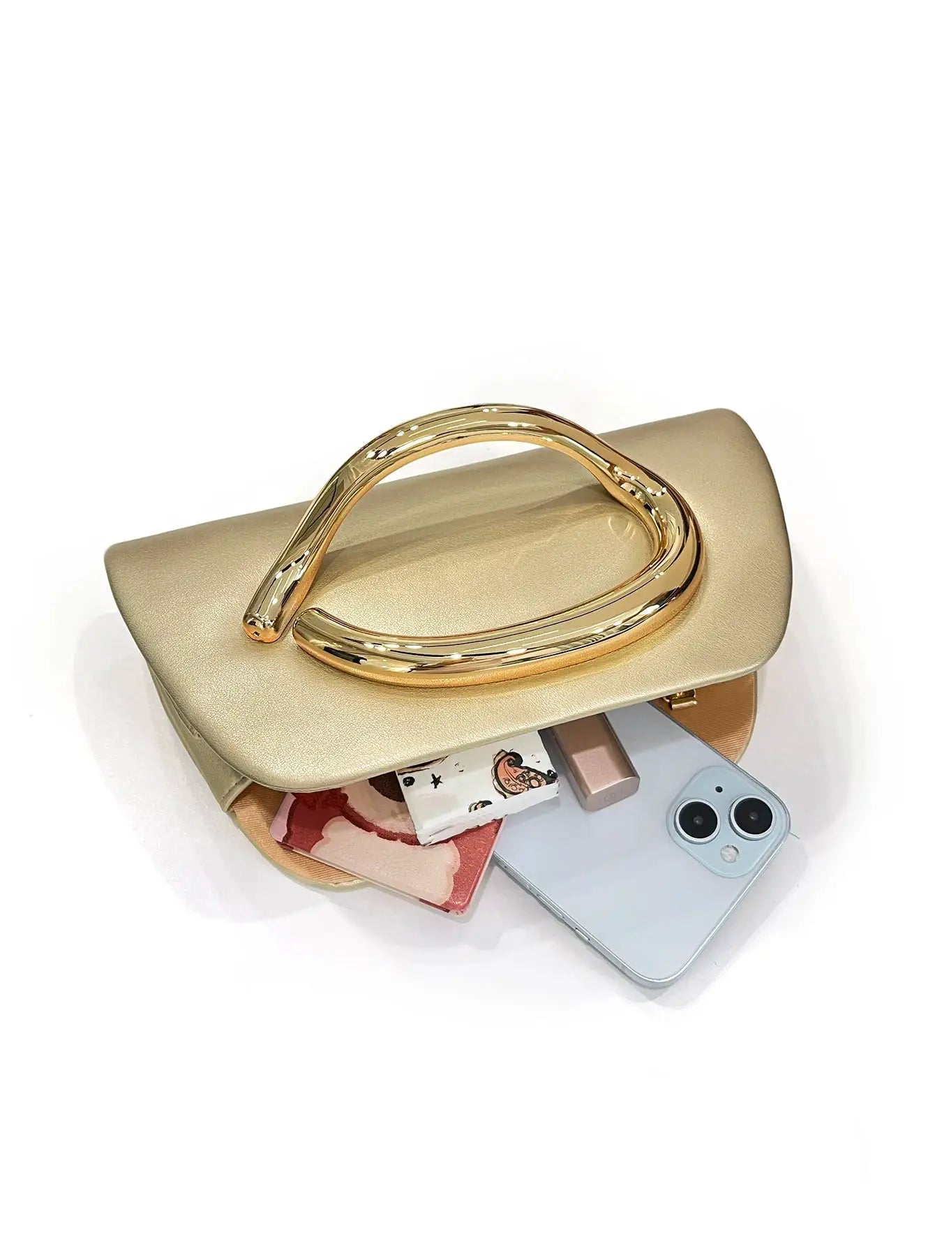 Gold metal buckle box clutch by Simples Market; beige metallic evening bag with a gold-tone handle.