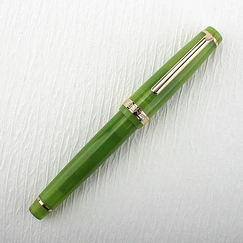 Jinhao 82 fountain pen in green acrylic with gold trim and clip, capped