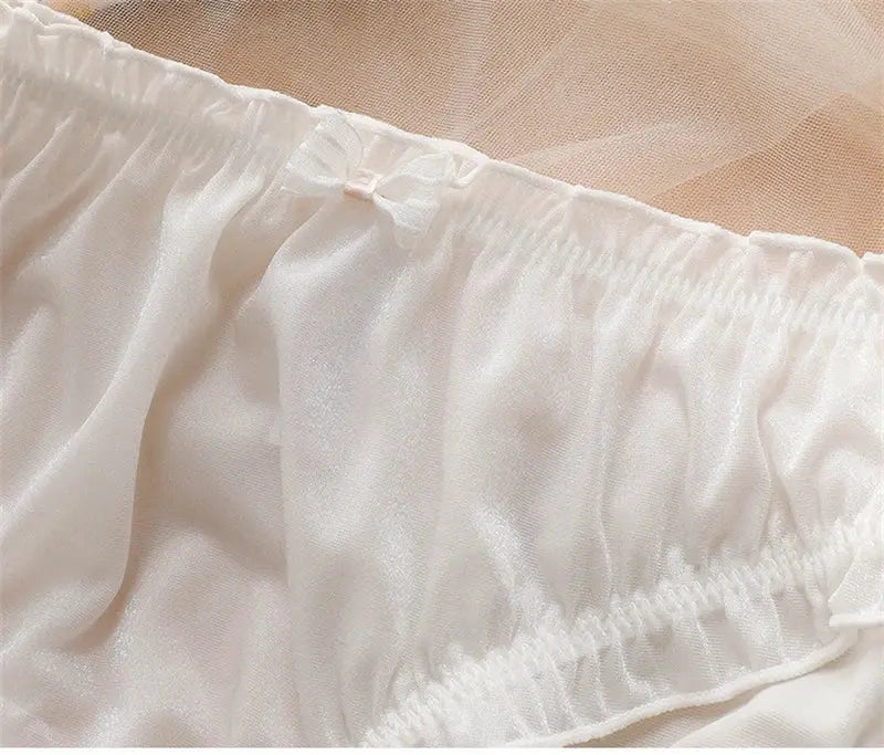 White ice-silk panties with sheer fabric and small bow detail