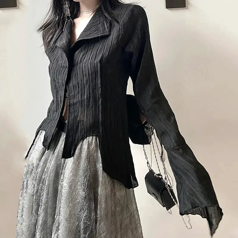 Karrram Gothic black shirt blouse with irregular hem over a metallic crinkled skirt; two-piece look