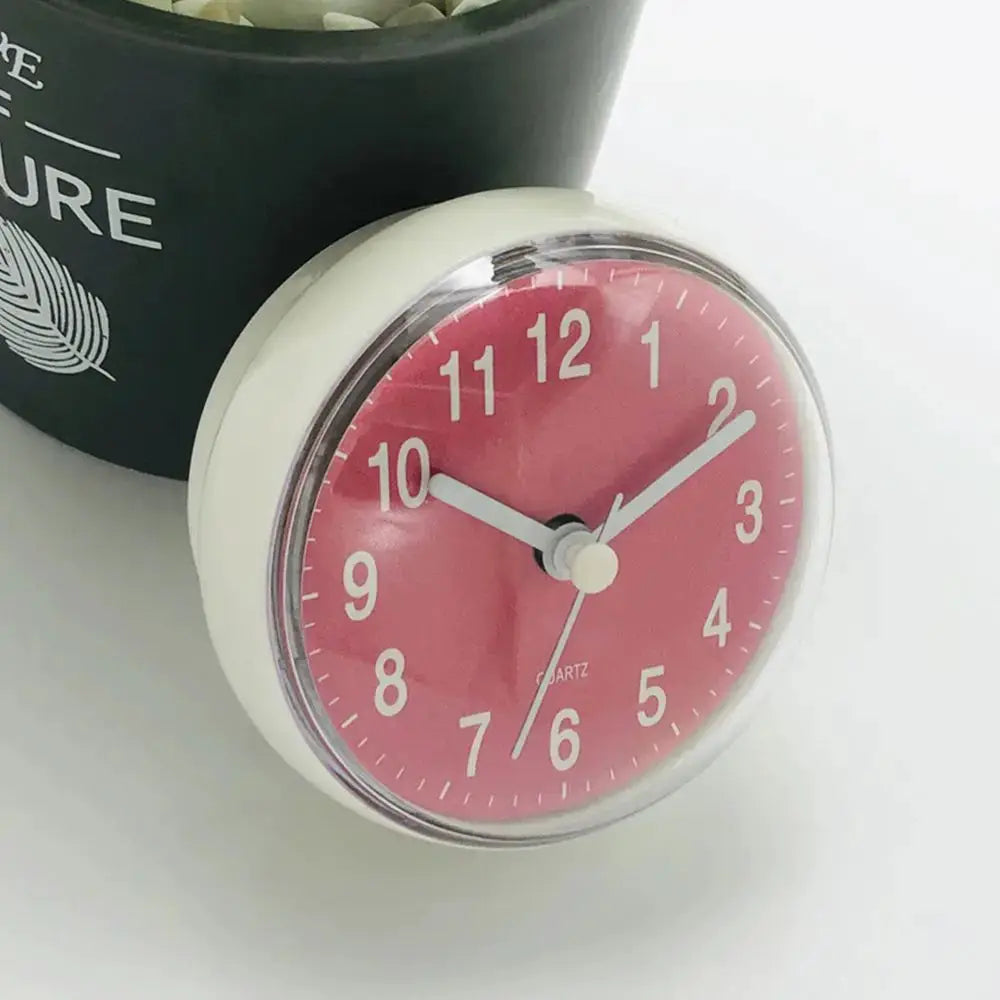 Mini suction wall clock; pink dial, white bezel, 7cm quartz