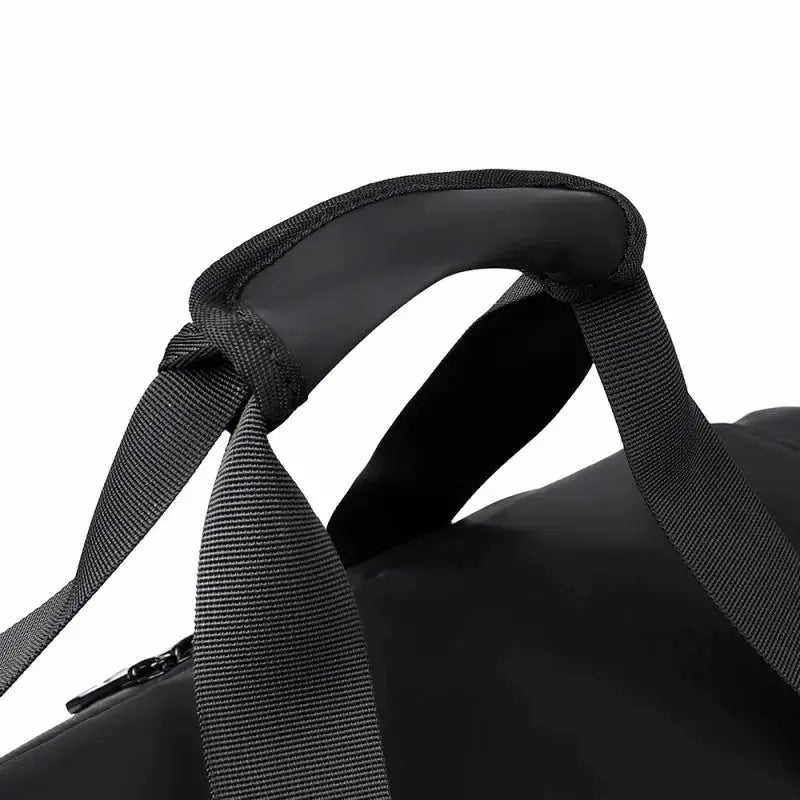 Large-capacity black sports gym bag with padded grab handle and adjustable shoulder strap