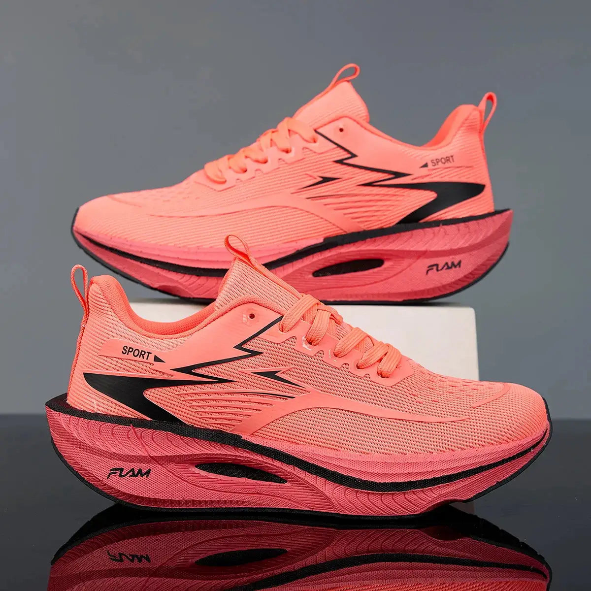Running shoes pair in pink mesh with black accents, breathable upper and cushioned non-slip sole.
