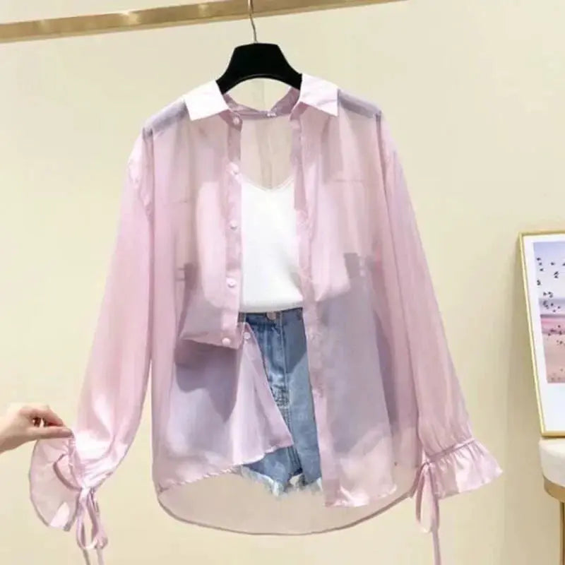 Simples Market pink chiffon blouse for women; sheer, loose button-up with long sleeves and tie cuffs.