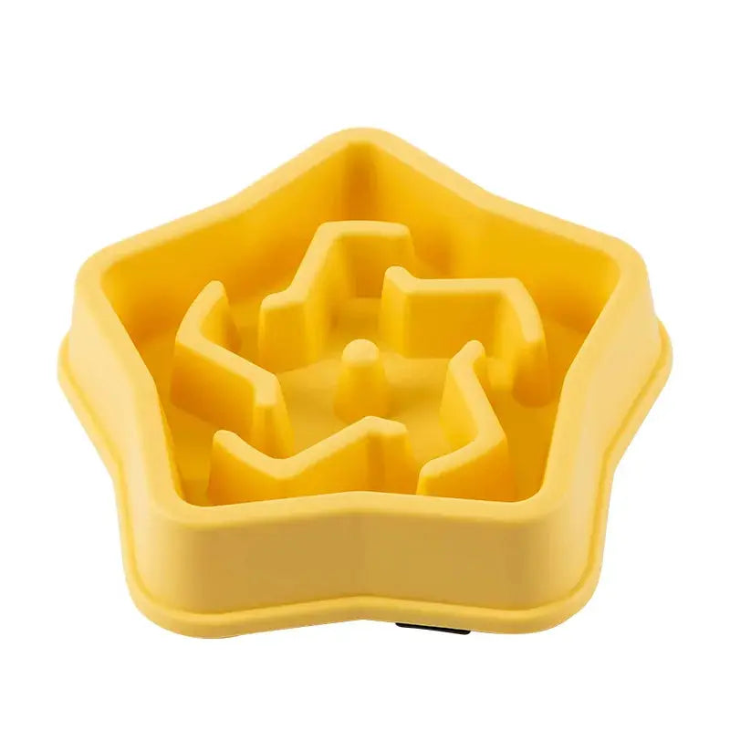 Star-shaped yellow pet slow-feeding bowl by Simples Market with inner maze design