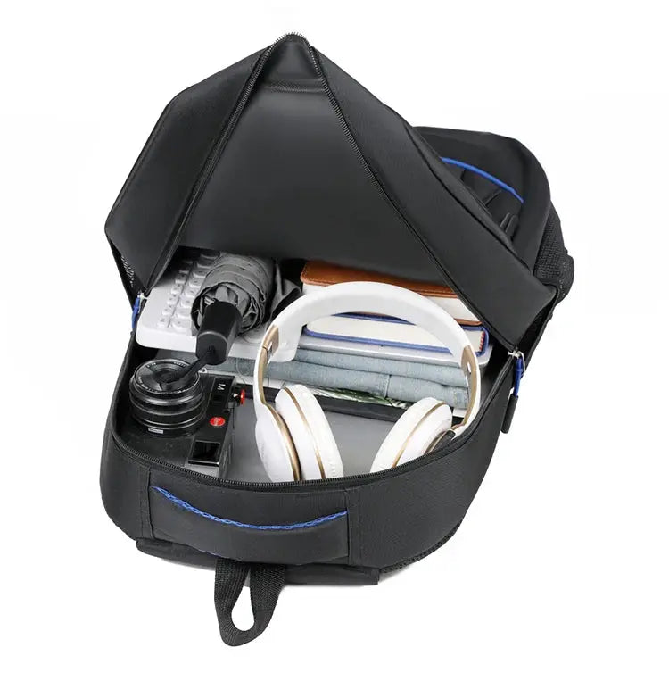 Backpack by Simples Market, black, large-capacity with headphones, camera and books inside.