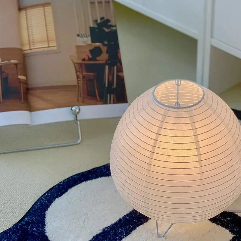 Japanese lantern LED table lamp with beige rice paper shade, warm ambient light.