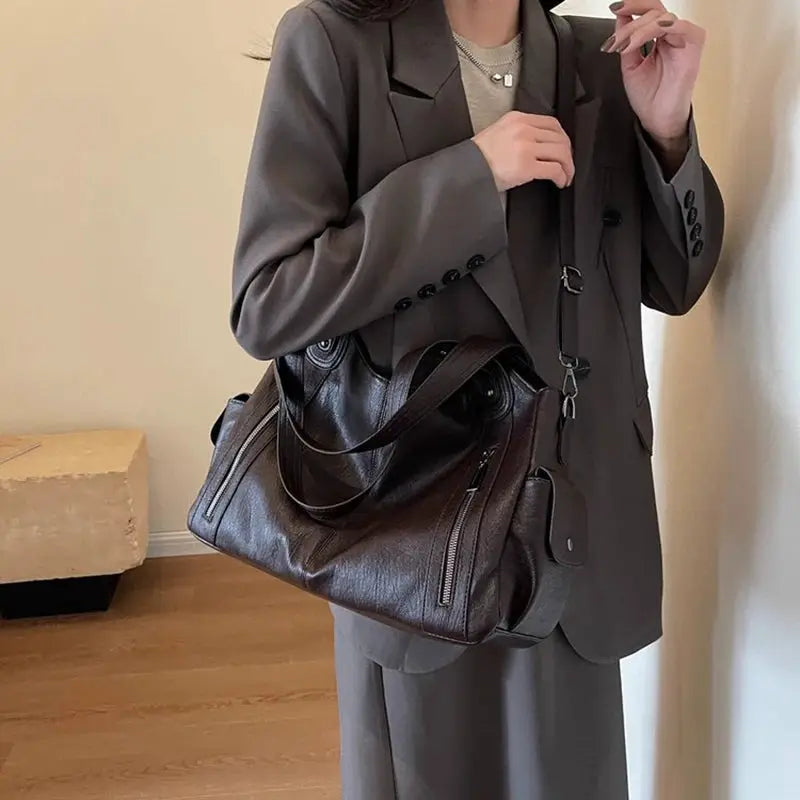 Shoulder bag by Simples Market, brown PU leather with crossbody strap and zip pockets
