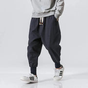 Men's cotton-linen harem pants in navy, baggy drop-crotch joggers with drawstring waistband.