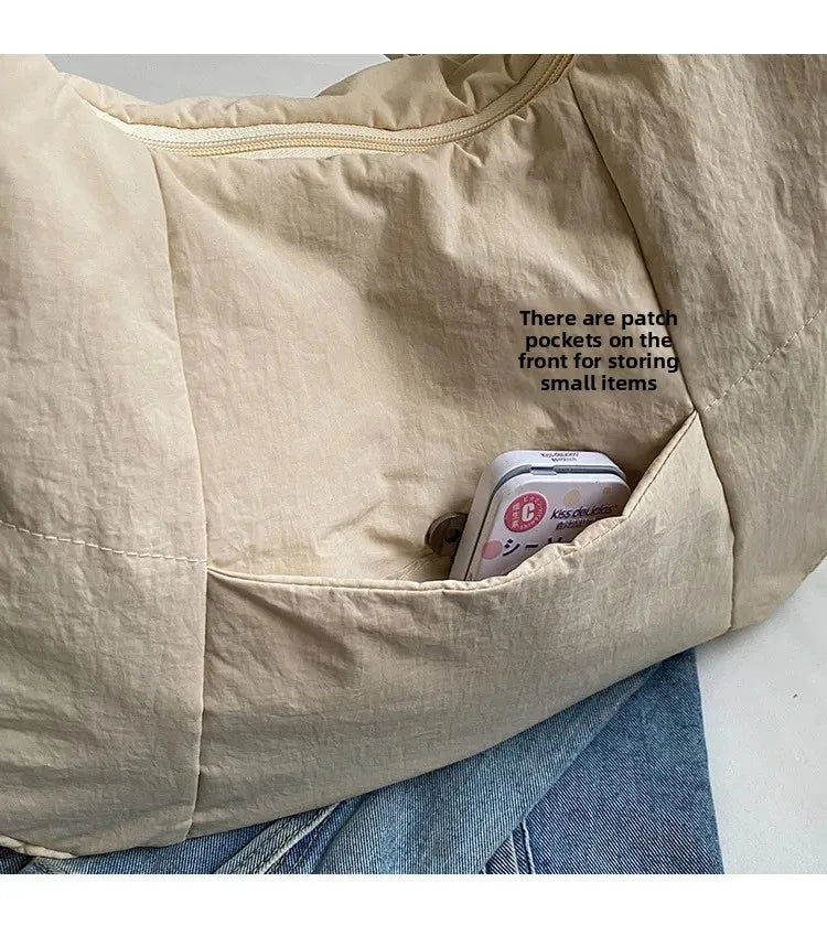 Trendy women's beige soft-cloth shoulder bag with front pocket for small items