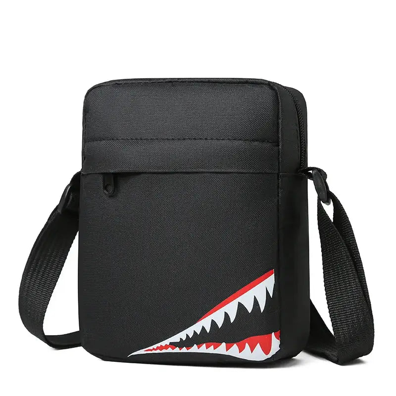 Single-shoulder crossbody bag in black with shark-teeth motif by Simples Market.