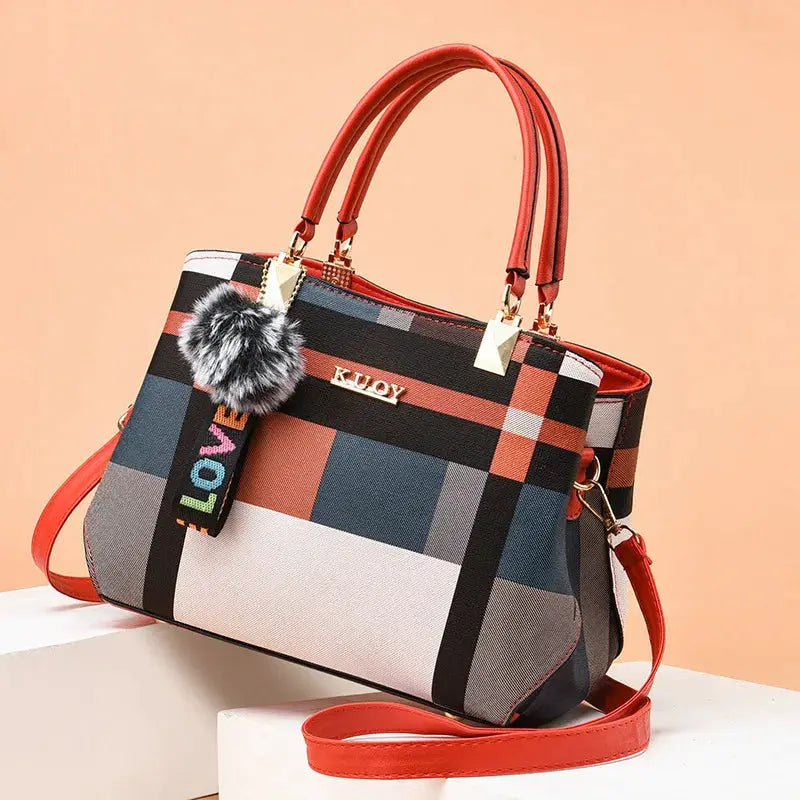 Designer handbag by Simples Market, plaid PU leather with red handles, crossbody strap and gold hardware
