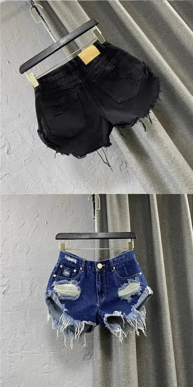 Two denim shorts on hangers: black frayed distressed shorts and blue ripped cut-off shorts
