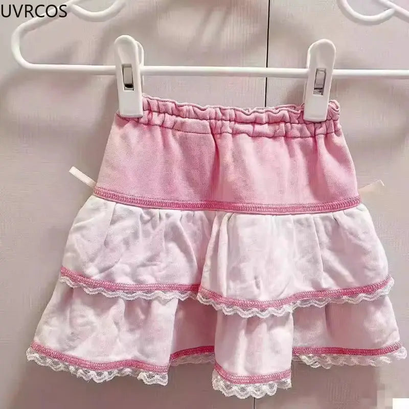 UVRCOS pink layered Lolita cake mini skirt with white lace trim and elastic waistband