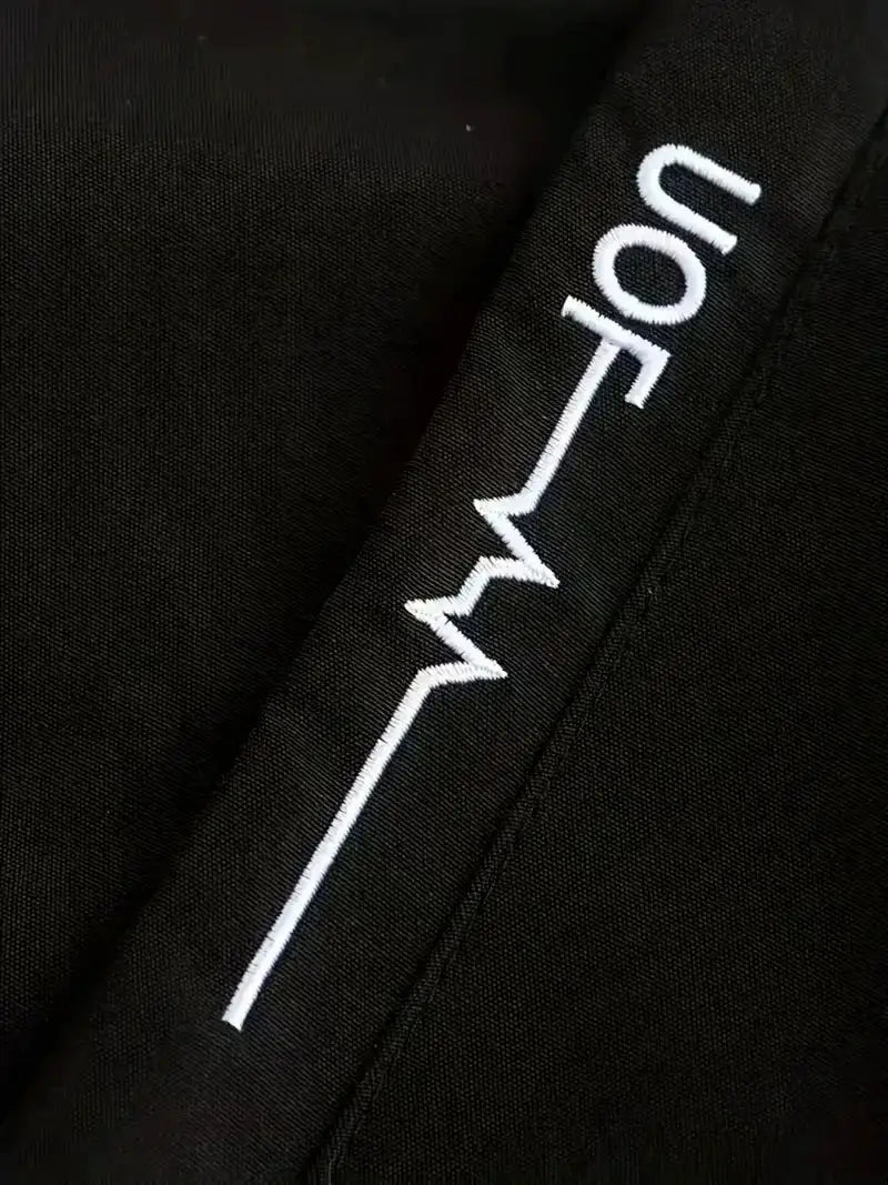 Men's black windbreaker jacket by Simples Market with white embroidery along the seam