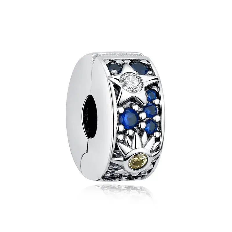 Sterling silver charm bead for bracelets with star and sun motifs and blue zircon accents