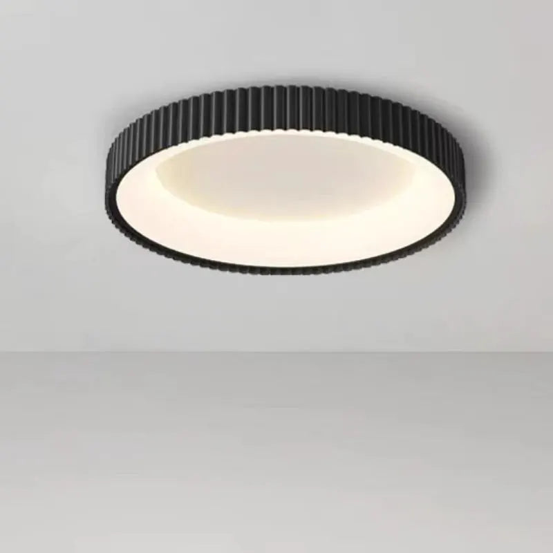 Modern round LED ceiling light by Simples Market; black metal exterior with white diffuser