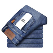 Blue denim jeans stack with white Fashion Jeans tag and leather patch label