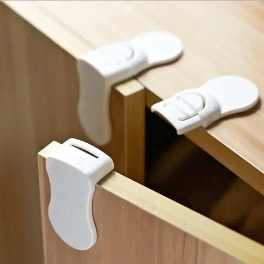 Set of three white plastic baby safety cabinet locks with anti-pinch buckles for drawers and cabinets