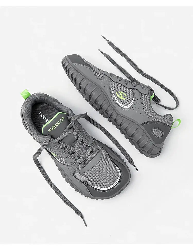 2 HOBIBEAR unisex wide-toe sneakers with gray mesh upper and neon lime-green accents, rugged sole.