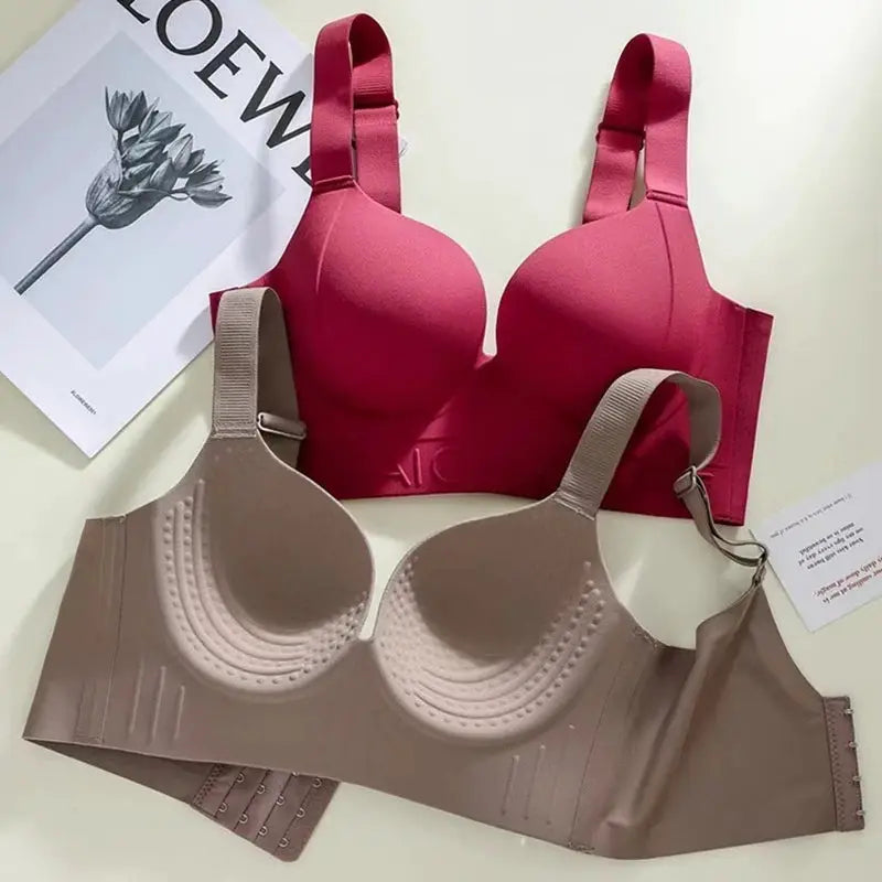 Two bras: hot pink padded bra and nude beige underwire bra
