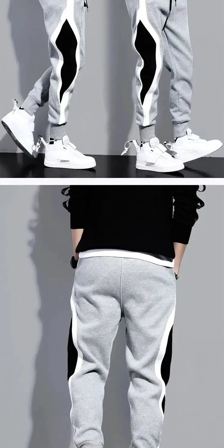 Autumn men's wide-leg patchwork jogger pants in grey with black side panels, elastic cuffs, breathable fabric