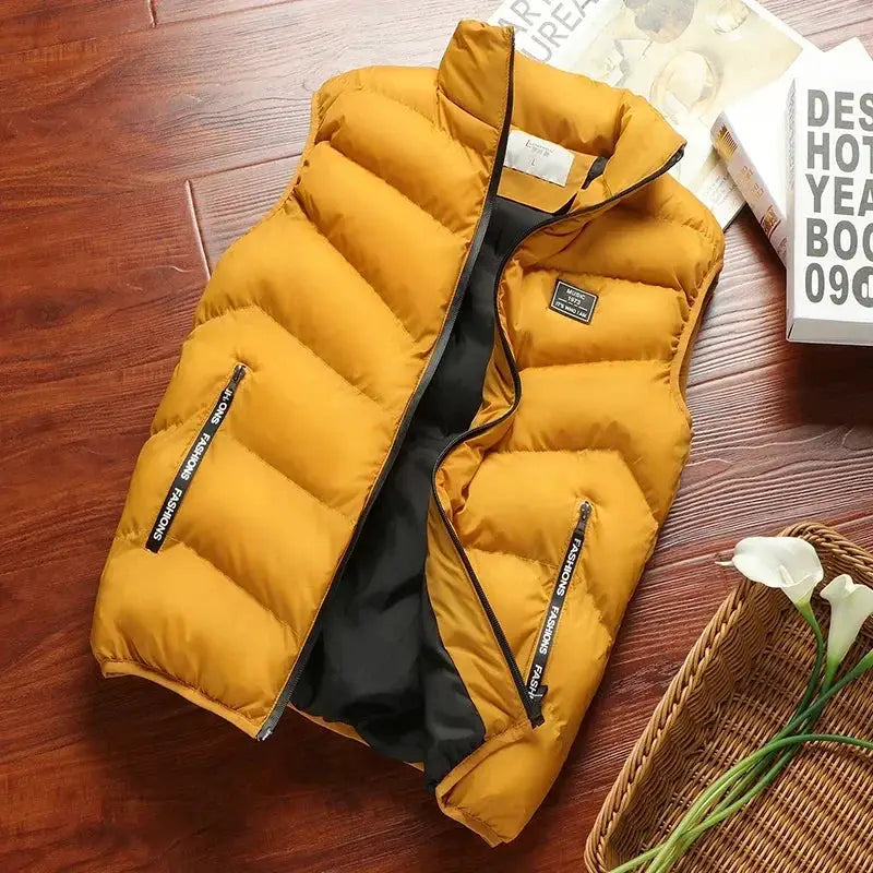 Men's mustard-yellow puffer sleeveless vest by Simples Market with black lining and side zip pockets, chest logo.