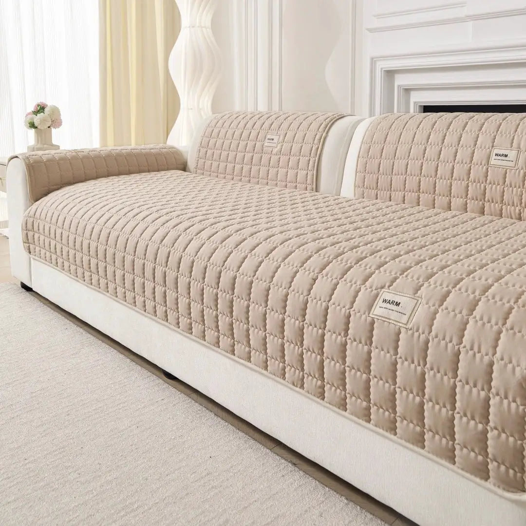 Beige quilted sofa slipcover set with anti-slip backing and matching armrest covers