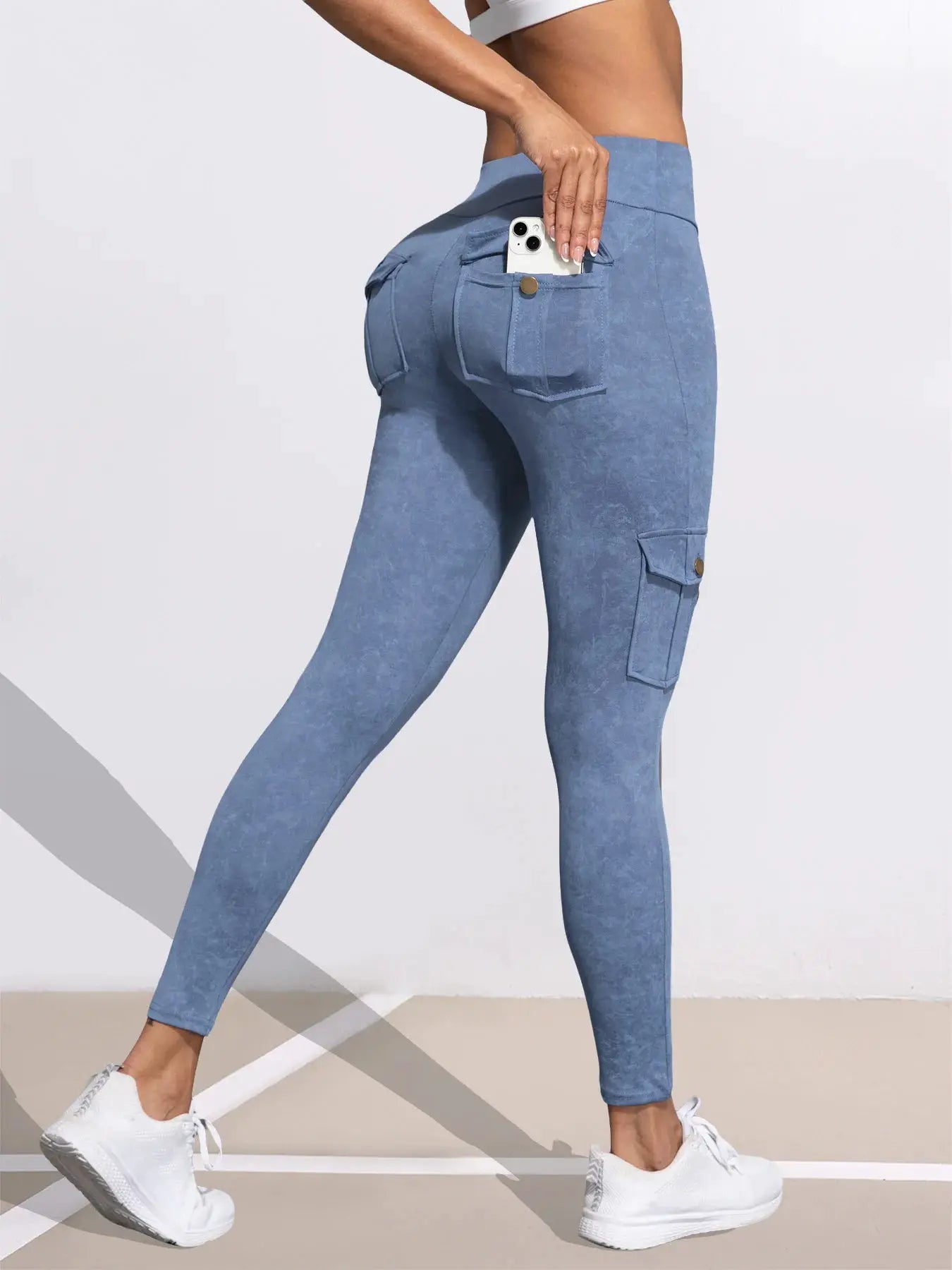 Women's blue washed-print leggings with back pocket and cargo pocket; phone in pocket.
