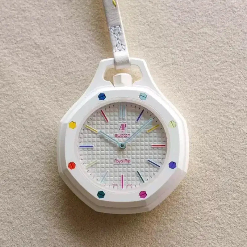 Pocket watch: AP Swatch Royal Oak replica in white case with multicolor gem markers and a white strap