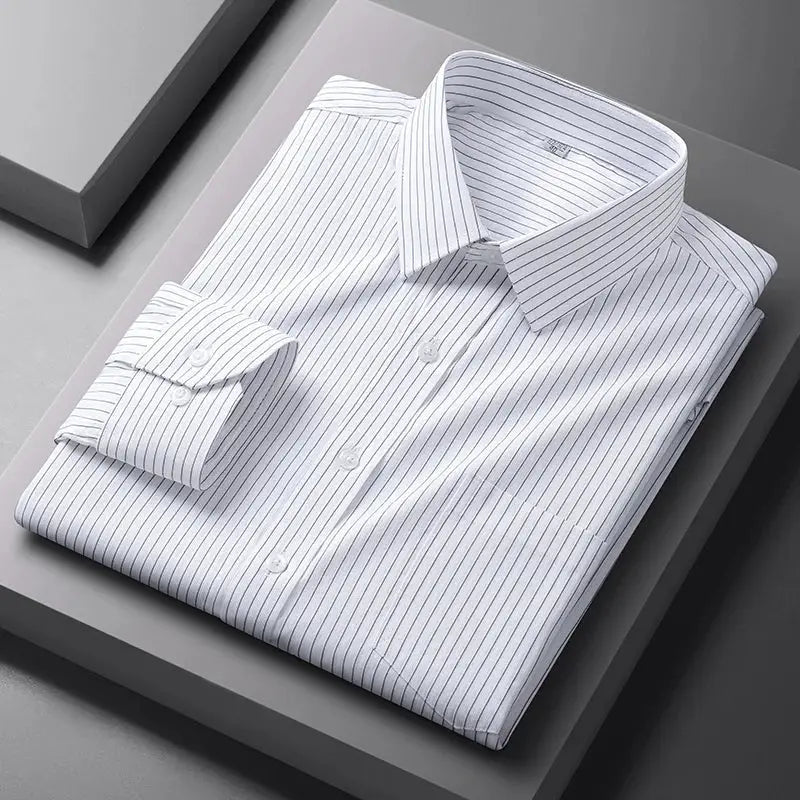 Men's striped dress shirt, white with blue pinstripes, long sleeves; folded neatly on a gray display platform, cuffs visible