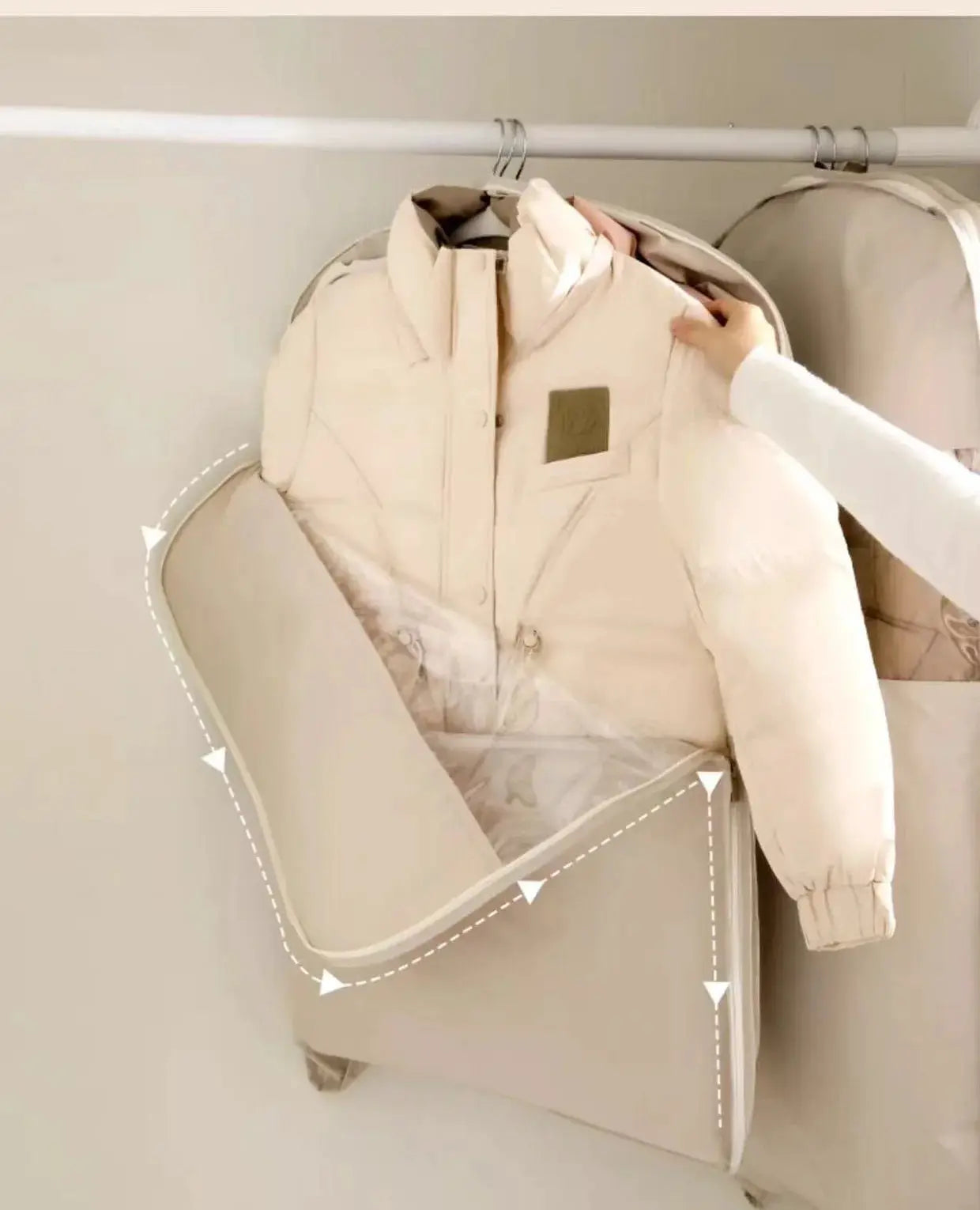 Clothing compression bag wardrobe organizer by Simples Market in beige for a down jacket, space-saving closet storage