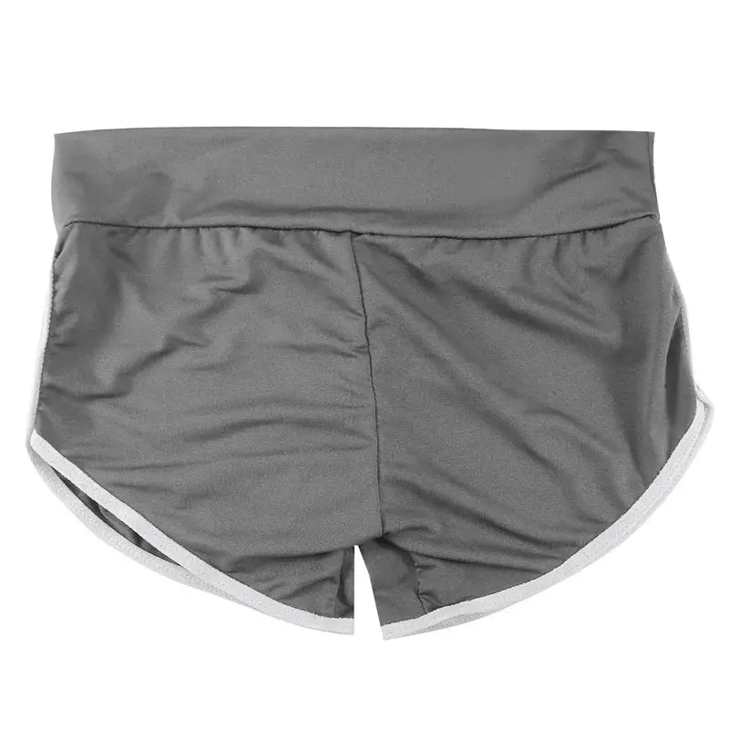 Women grey athletic shorts with white trim; low-waist, stretchy gym/yoga shorts for sports.