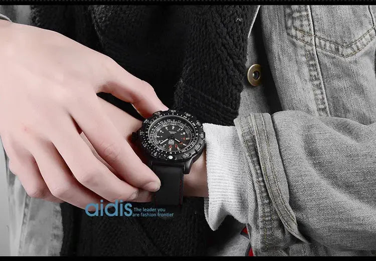 Addies military watch on black strap with luminous dial; aidis logo visible
