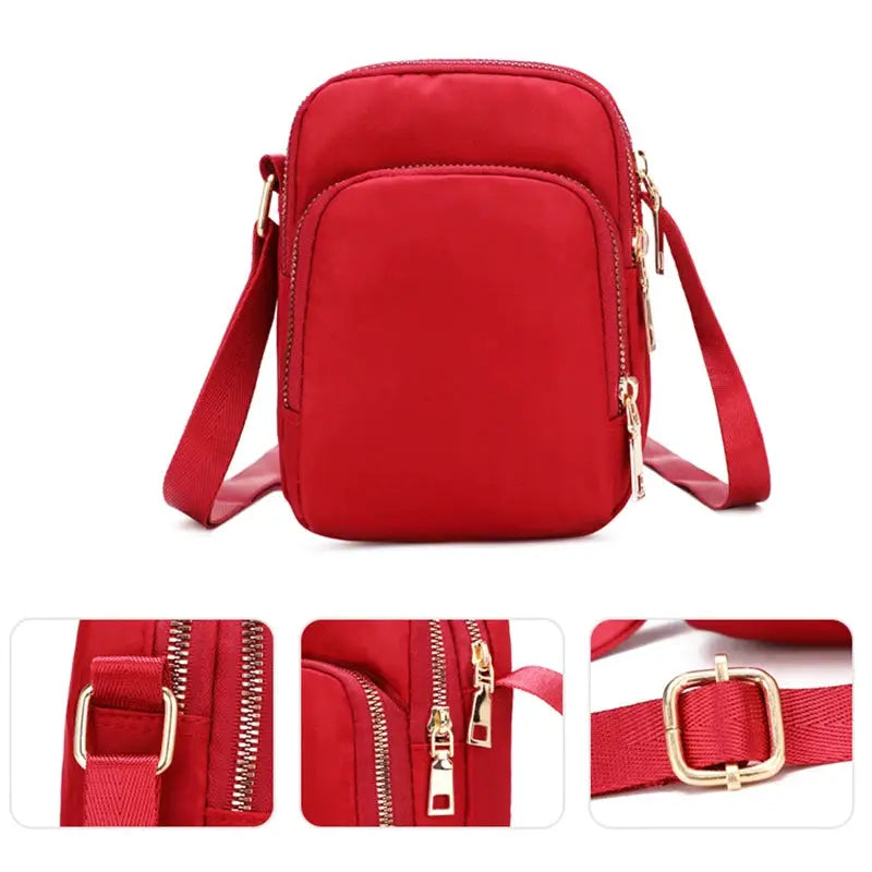 Women's crossbody bag, red waterproof with gold zippers and adjustable strap.