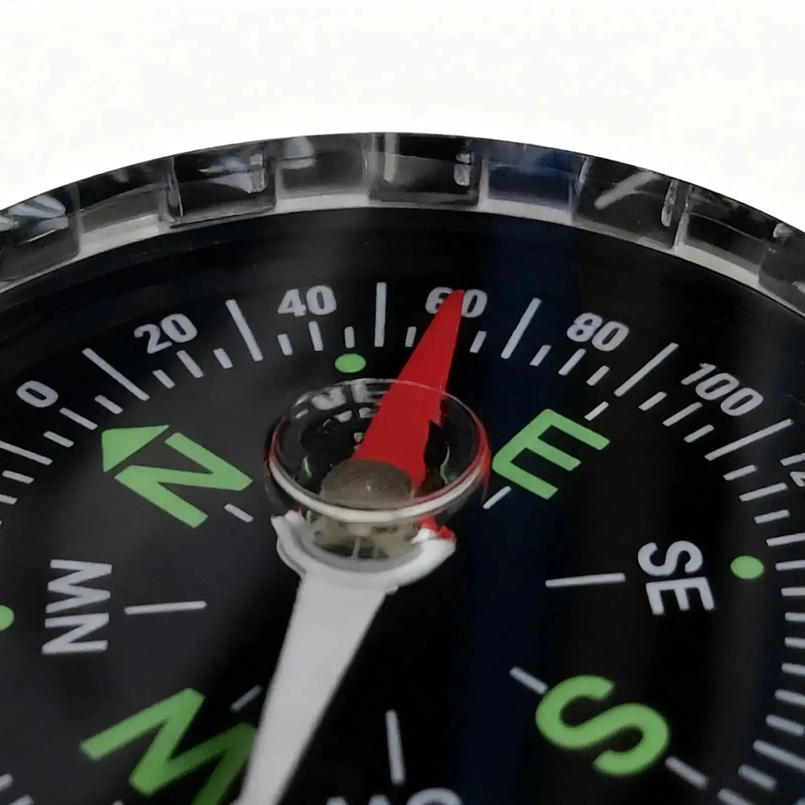 Waterproof hiking compass with red needle on black dial and white degree markings.