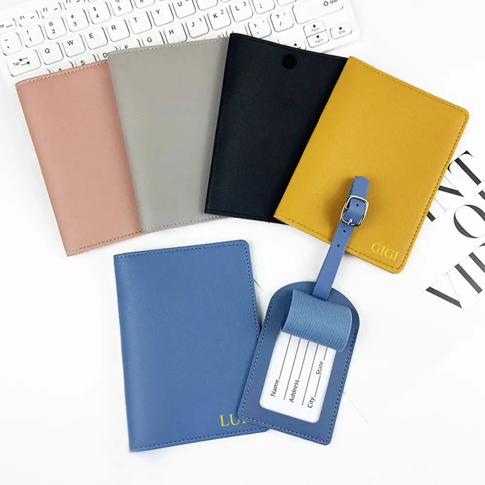 Custom name passport cover set by Simples Market; pink, gray, black, yellow, blue covers with blue luggage tag