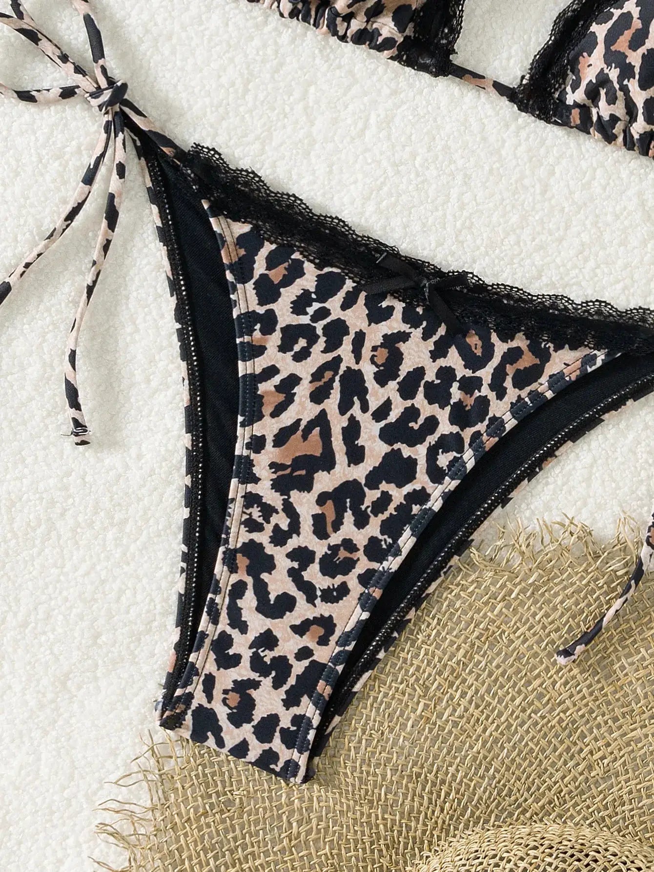 Leopard print triangle bikini set with black lace trim and tie-side bottoms