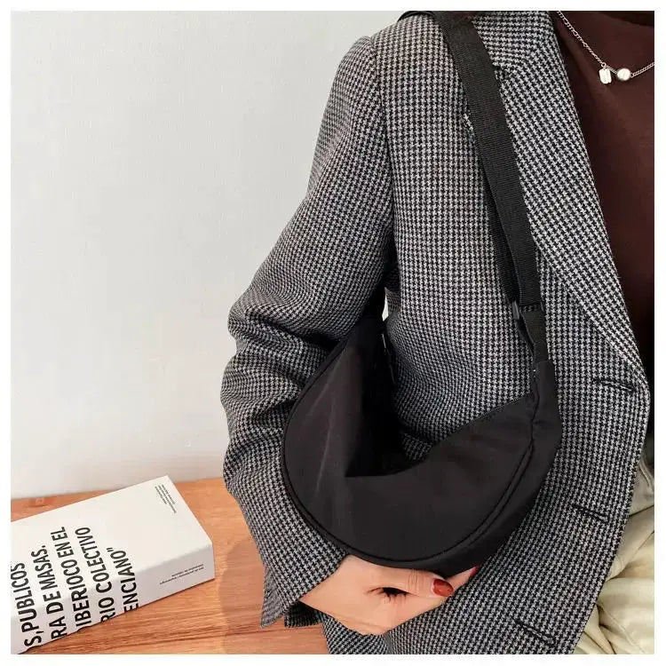 Nylon dumpling bag, black small crossbody bag with a curved crescent silhouette