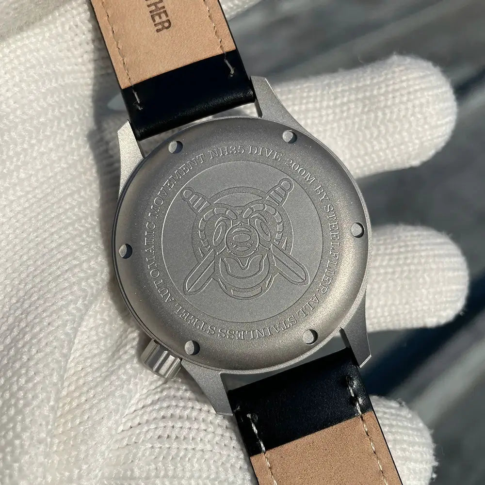STEELFLIER SF752 mechanical wristwatch from Simples Market with leather strap and engraved stainless steel case back.